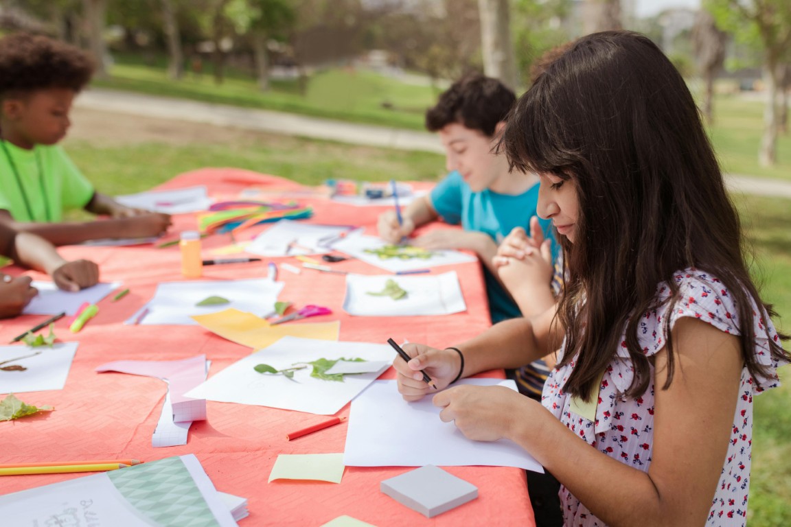 Children working on art outdoors